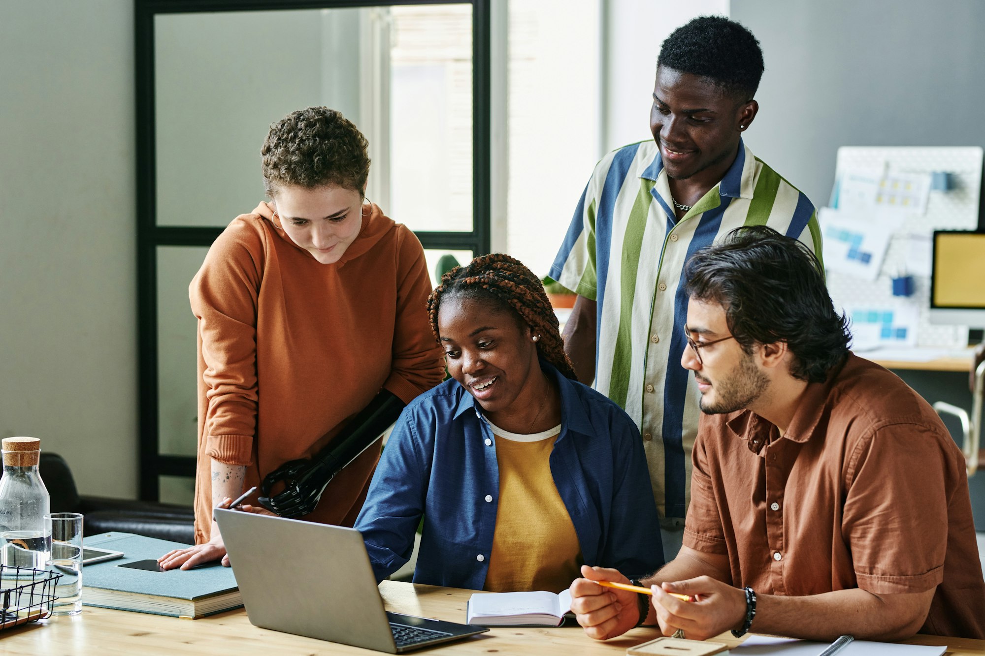 group-of-intercultural-employees-listening-to-colleague.jpg